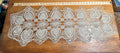 Vintage handmade crocheted ecru lace table runner with a pineapple pattern.